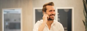 How to prepare for a telephone interview man smiling on phone